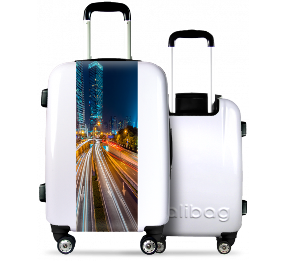 White Suitcase Illuminated City